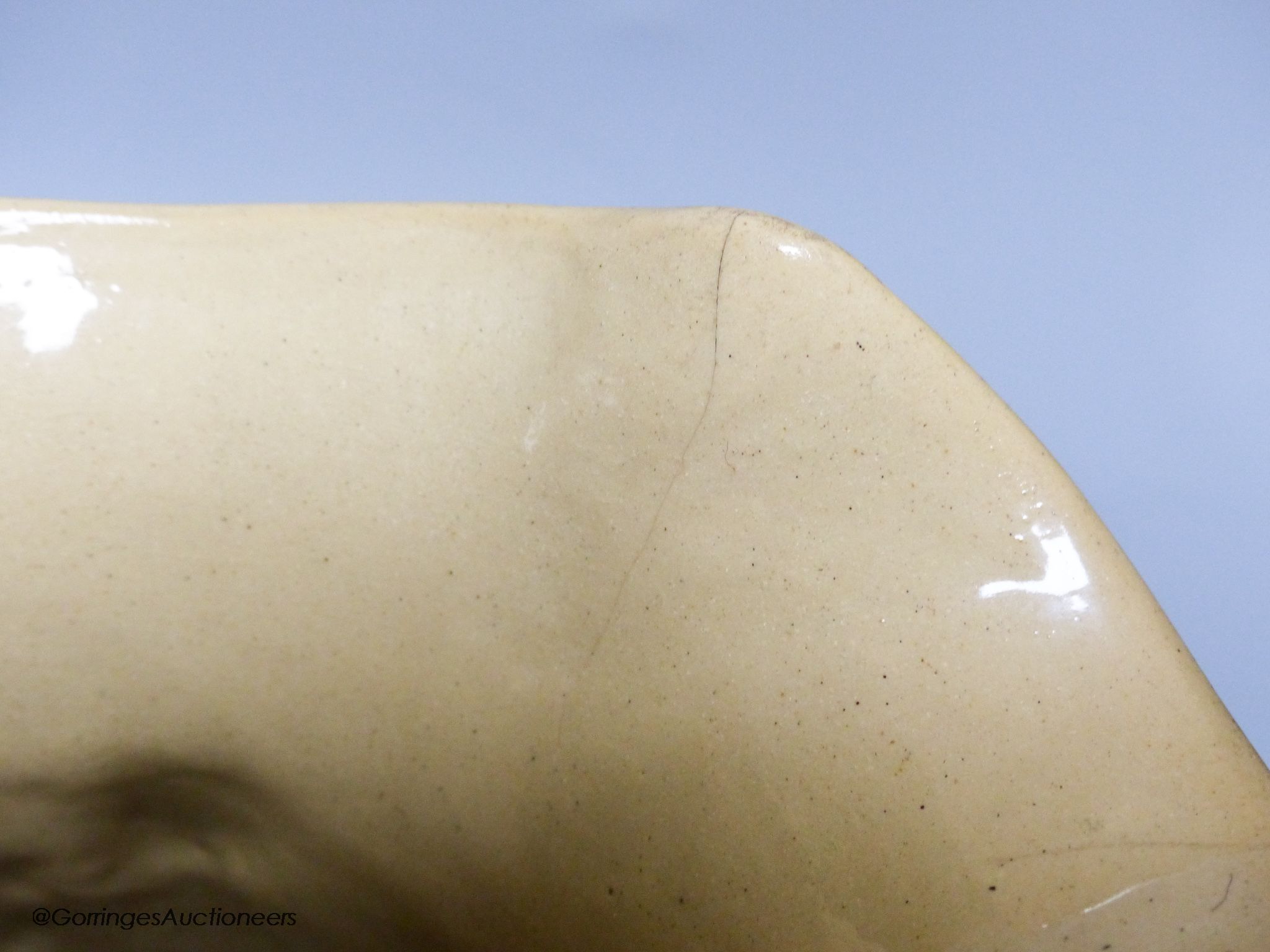 A Victorian relief moulded buff coloured stoneware jug by Samuel Alcock, The Seige of Acre, circa 1850.